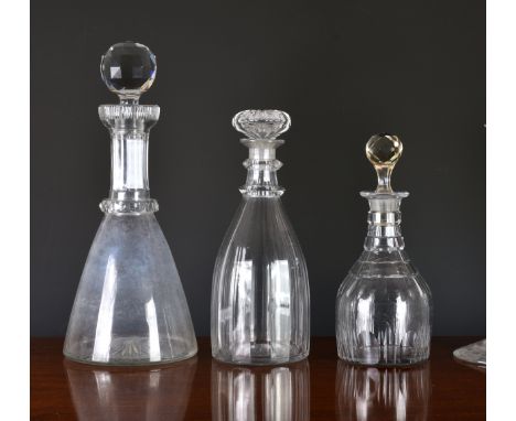 A Georgian panel cut decanter, with two facet cut neck rings and ground pontil, 10½in. (26.7cm.) high overall; together with 