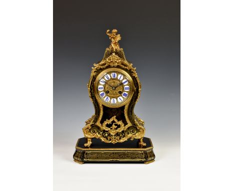 A French Boulle inlaid striking mantel clock, late 19th century, the balloon shaped case with gilt metal foliate scroll, husk