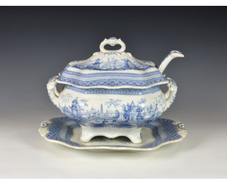 A 19th century English blue &amp; white pottery transferware soup tureen and cover, with stand and ladle, of typical shaped o