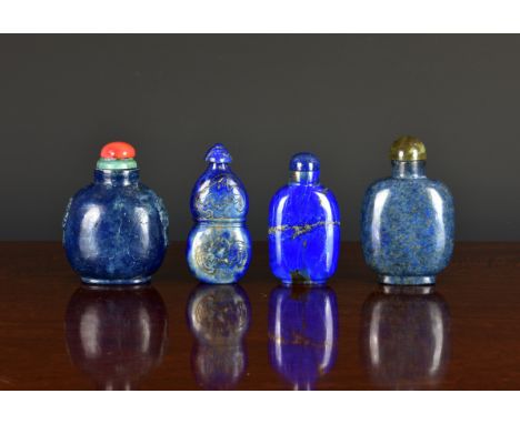 Four Chinese lapis lazuli snuff bottles, 20th century, the first of flattened double gourd form with shaped conical stopper, 