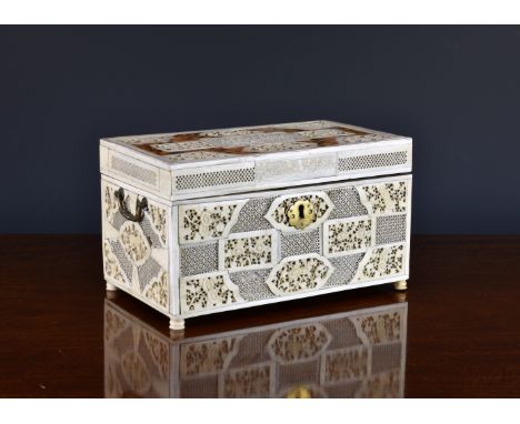 A Chinese export blonde tortoiseshell and ivory tea caddy, 18th century, of rectangular form, the exterior with carved and pi