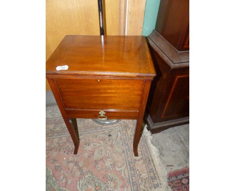 A Mahogany Workbox Table, the lid lifting to reveal a peach coloured fabric lined interior with various sewing tools, a friez
