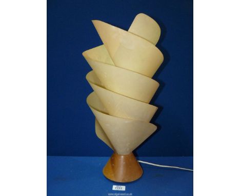 A vintage teak based Lamp having a spiral shade, 20" tall.