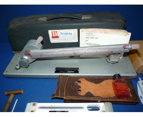 A Whirling psychrometer in case by Casella with spare thermometer, a Manometer by Airflow Developments Ltd and a Pilot static
