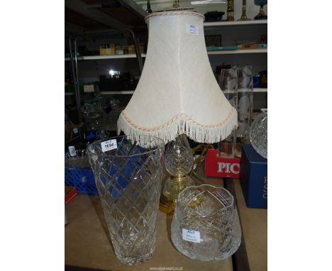 Two cut glass vases and a cut glass lamp.