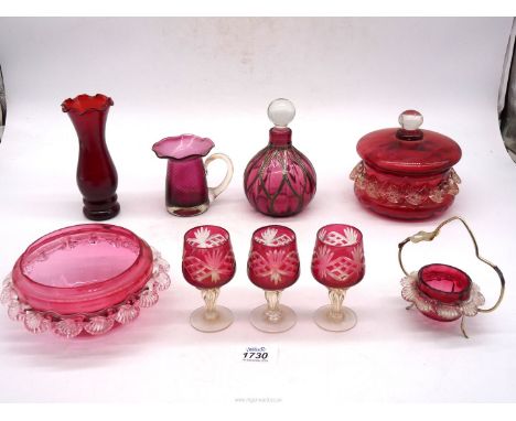 A quantity of cranberry glass including a scent bottle with hallmarked silver overlay, trinket pot 'Anchor Hocking', ruby red