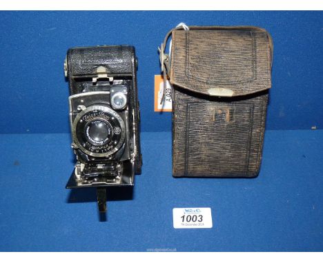 A Zeiss Ikon Icarette folding bellows Camera with Carl Zeiss Jena Tessar 7.5cm f/4.5 Lens and Compur Shutter, with leather ca