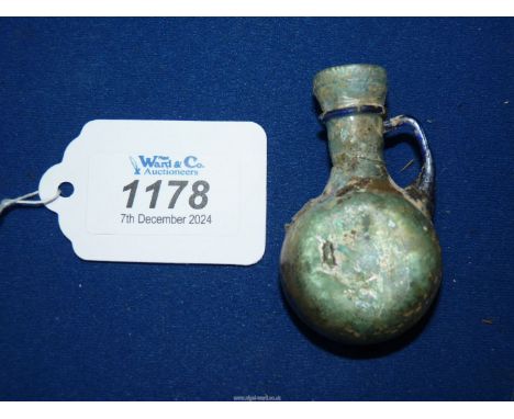 An attractive late Roman glass flask applied with a blue band to the shoulder and a blue handle, circa 4th century, 2 3/4" ta