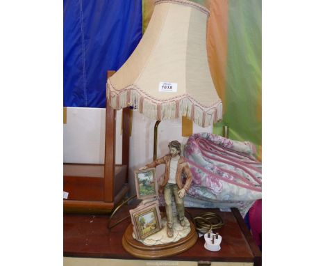 A Capo-di-monte table Lamp depicting artist with pictures, 24 1/2" tall overall including the shade.
