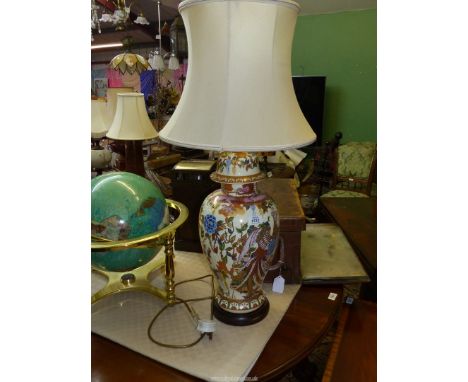 An oriental style Table lamp decorated with pheasants, dragons and flowers in orange and blue and pink with gilt detail, 33" 