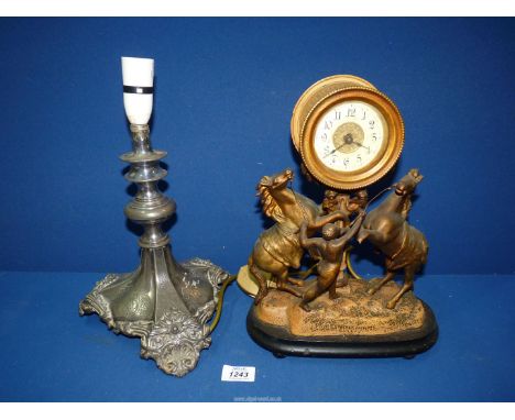 A plated Walker & Hall table Lamp and a cast metal mantle Clock with Marley figure of man calming two rearing horses, both 13