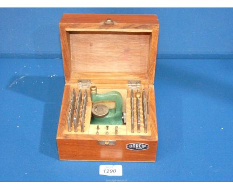 A wooden cased set of Dracip watchmaker's staking tools.