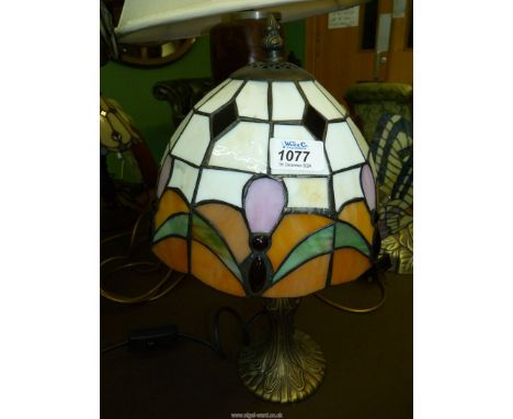 A small Tiffany style Table lamp with cream, orange, green and pink shade, 15" tall, a/f.