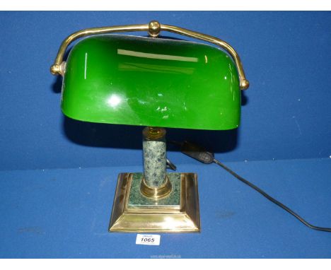 A Banker's Lamp with green shade and brass and stone base.