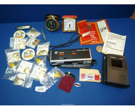 A pair of travel alarm clocks, a Citizen ST 555 hand held TV, a Minolta Autopak 460Tx film camera, Churchill crown, various b