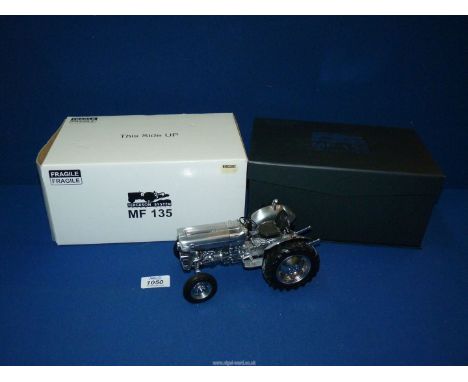 A Modelzone Limited Edition of 1000 'MF135' model tractor, in silver, boxed. (No. 42 of a limited edition of 1,000).