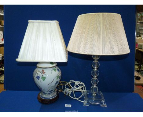 A glass table lamp with gold shade and a porcelain Ginger Jar decorated with egrets and pond-lie, converted into a table lamp