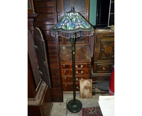 A Tiffany style Standard Lamp with white, purple and green iris shade, 62" overall.