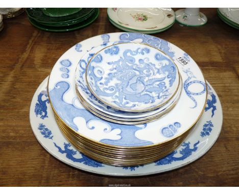 Ten Royal Worcester Blue Dragon soup dishes and four saucers plus a Cauldon meat plate of similar design.