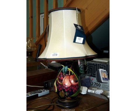 A Moorcroft 'Queens Choice' table lamp and shade, as new, still with labels.
