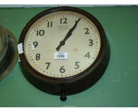 A Military Smiths eight day Bakelite circular Wall clock with Arabic numerals, 11" diameter (with arrow mark).