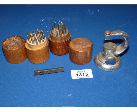 A G.Boley watch makers staking tool and two Treen cases containing hole closing punches, etc.