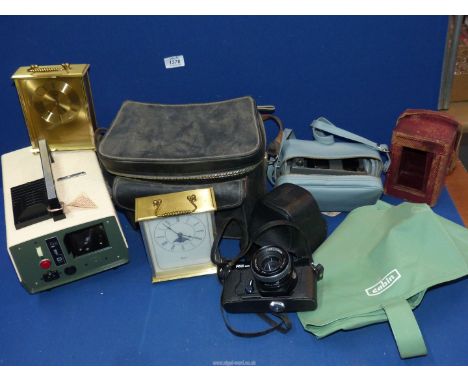 A quantity of clocks and cameras to include: a Cabin automat projector, carriage clock case, Topcan RE 200 camera, Woodford c