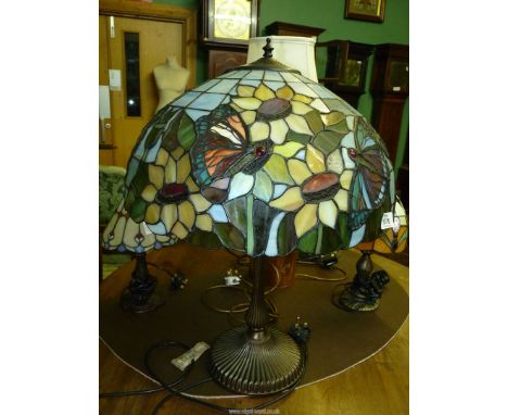 A Tiffany style Table lamp with butterfly and sunflower shade, 24" tall.