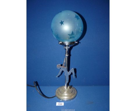 An Art Deco chrome Table lamp with blue star frosted glass globe shade supported by a dancer, 18" tall overall (working at ti