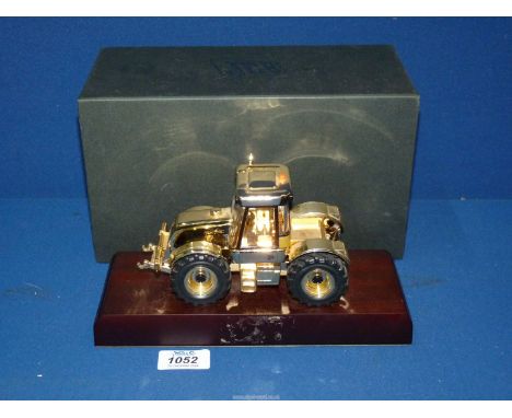 A JCB Fast trac 3185 tractor, Specialist Collectors Edition, scale model, finished in gold, boxed (plaque missing).