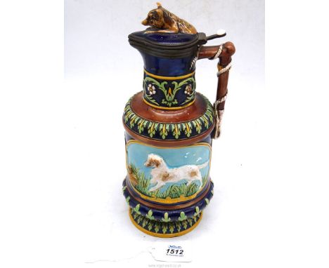 A Majolica fox and hound stein/pitcher with whip handle and 1872 registration mark to base (lid cracked), possibly George Jon
