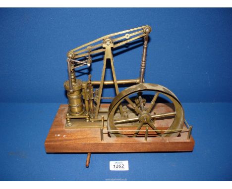 A nicely engineered , fashioned mainly from brass, steam powered model Beam Engine, having a 6'' diameter flywheel driven by 