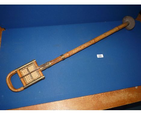 A shooting stick made of rattan and bamboo.