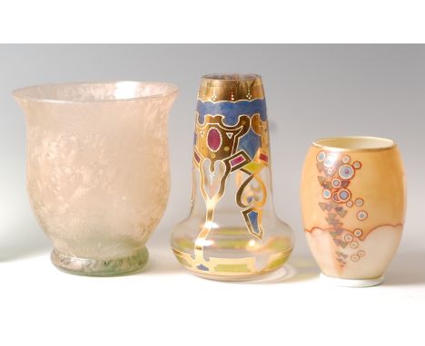 A 1960s iridescent art glass vase, having flared rim and of slightly lower bulbous form to raised foot, h.20cm; together with
