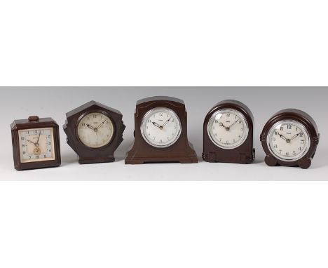 Five Art Deco bakelite mantel clocks by Ferranti, each of various forms, with winding movements, the largest h.15.5cm (5)