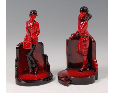 Peggy Davies Ceramics - Ruby Fusion model of a lady carrying a hat-box, printed backstamp verso, h.25.5cm; and one other simi