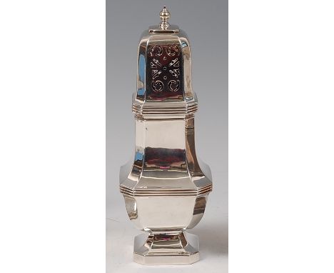 An Art Deco silver lighthouse sugar caster, having removable pierced cover, with chamfered corners and reeded detail to pedes