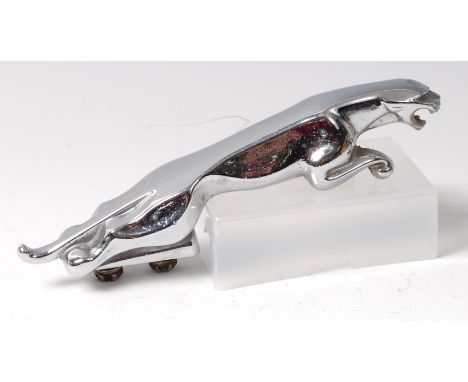 An Art Deco period Jaguar chrome car mascot, of typical stylised form, with twin screw fittings to underside, length 19.5cm 