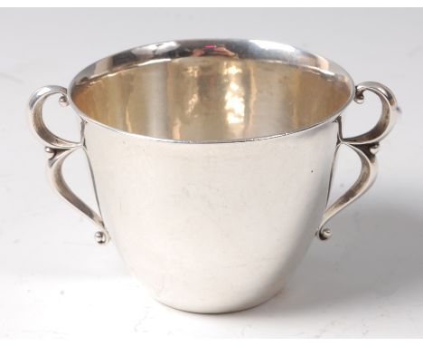 Georg Jensen (1866-1935) - An early 20th century Danish silver twin handled sugar bowl, having hammered interior, with double