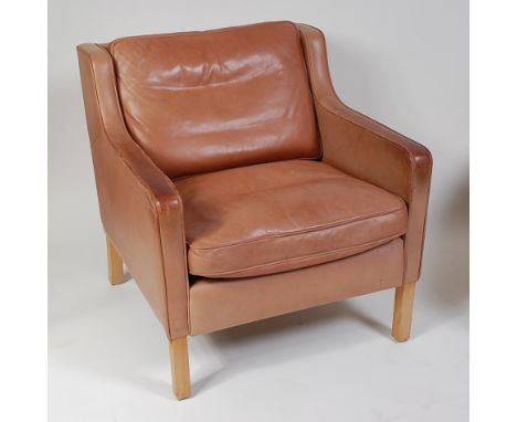 A 1960s Stouby tan leather armchair, in the manner of Børge Mogensen, with cushion back and seat, raised on beech supports, w