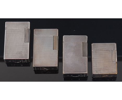 Four 1960s Dupont silver plated pocket lighters, each with hinged covers and raised engine turned decoration, numbered 458400