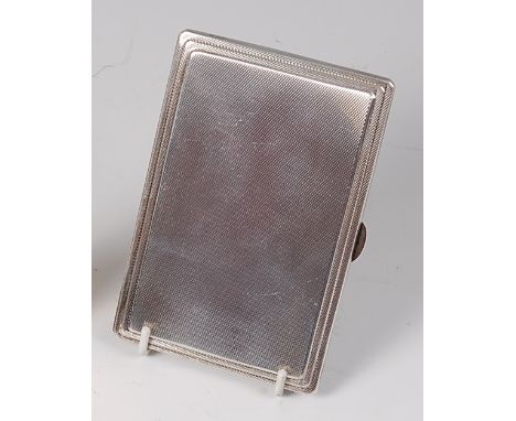 A late Art Deco silver pocket cigarette case, having a stepped engine turned exterior, gilt washed interior, later inscribed 