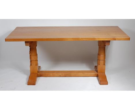 After Robert 'Mouseman' Thompson - A joined light oak dining suite, comprising round cornered plank topped refectory table, r