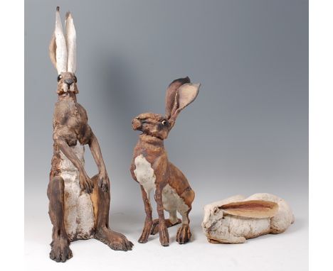 Jeremy James - A large contemporary ceramic model of a seated hare, painted in tones of brown and white, with incised detail,