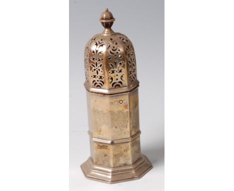 An Art Deco silver octagonal sugar caster, having a knopped finial, pierced cover, and on protruding base, marks heavily rubb