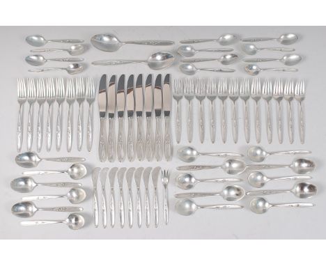 A mid-20th century American sterling silver cutlery suite, in the Art Nouveau style, the handles each with raised floral trai