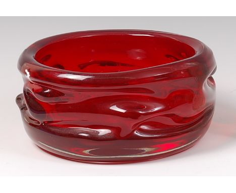 A Whitefriars knobbly ruby glass fruit bowl, of circular form, designed by Harry Dyer & William Wilson, circa 1965, dia. 22.5