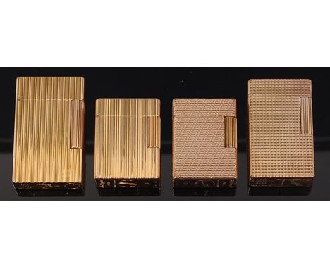 Four 1960s/70s Dupont gold plated pocket lighters, each with hinged cover and raised engine turned decoration, numbered 0ABS2