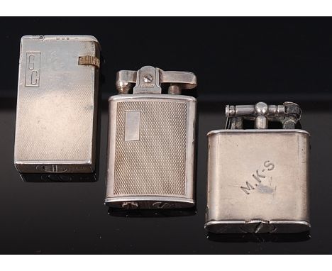 A 1930s silver pocket lighter by Dunhill, having engine turned exterior, monogrammed 'GC', London 1936, numbered '440072', 6c