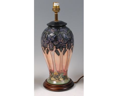 A contemporary Moorcroft Pottery table lamp, in the Cluny pattern, of baluster form, underglaze painted and tube-line decorat